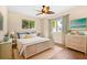 Bedroom featuring hard wood floors and lots of natural light at 10 Venetian Cir, Port Orange, FL 32127