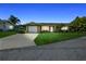 Charming single-story home with a well-manicured lawn and attached one-car garage at 10 Venetian Cir, Port Orange, FL 32127