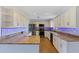 Renovated kitchen with granite countertops, stainless steel appliances, and under cabinet lights at 10 Venetian Cir, Port Orange, FL 32127