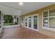 Enclosed patio features large windows offering lots of light and waterfront views at 10 Venetian Cir, Port Orange, FL 32127