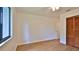 This bedroom features hardwood floors, a ceiling fan, and a window for natural light at 1017 Chippewa Trl, Daytona Beach, FL 32117