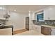 Updated kitchen featuring stainless steel appliances, white cabinetry, and stylish backsplash at 1017 Chippewa Trl, Daytona Beach, FL 32117