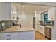 Modern kitchen with white cabinets, stainless steel appliances, and sleek countertops at 1017 Chippewa Trl, Daytona Beach, FL 32117