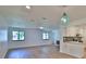 Spacious living room featuring sleek flooring and a seamless connection to the modern kitchen at 1017 Chippewa Trl, Daytona Beach, FL 32117