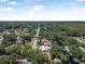 Experience the serenity of this lush neighborhood with tree-lined streets from this aerial view at 1085 Indigo Rd, Ormond Beach, FL 32174