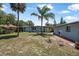 Enjoy the outdoors in this spacious backyard with mature trees, a brick path and covered patio at 1085 Indigo Rd, Ormond Beach, FL 32174