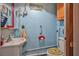 Nautical themed bathroom with a unique vanity, decor, and beachy accents at 1085 Indigo Rd, Ormond Beach, FL 32174