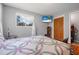 Inviting bedroom with hardwood floors and a large window at 1085 Indigo Rd, Ormond Beach, FL 32174