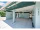 Spacious carport with ample lighting, ceiling fans, and a unique lattice brick design at 1085 Indigo Rd, Ormond Beach, FL 32174