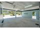 Well-lit carport featuring ceiling fans, lattice block accents, and plenty of space for parking at 1085 Indigo Rd, Ormond Beach, FL 32174