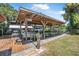 Waterfront dock with boat lift, offering a picturesque setting with lush greenery and a tranquil waterway at 1085 Indigo Rd, Ormond Beach, FL 32174