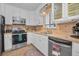 Charming kitchen with stainless steel appliances and tiled flooring at 1085 Indigo Rd, Ormond Beach, FL 32174