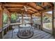 Enclosed patio featuring a table, seating, and screened walls with views of the water at 1085 Indigo Rd, Ormond Beach, FL 32174