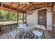 Enclosed porch featuring an outdoor table and chairs with view of lawn at 1085 Indigo Rd, Ormond Beach, FL 32174