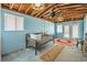 Bright sunroom with wood ceiling, and casual seating perfect for relaxing and enjoying natural light at 1085 Indigo Rd, Ormond Beach, FL 32174