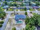 Aerial view of the home featuring a screened-in pool and a well-maintained yard at 1104 W Seagate Dr, Deltona, FL 32725