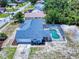 Aerial view showcasing a screened-in pool, spacious yard, and a well-maintained roof at 1104 W Seagate Dr, Deltona, FL 32725