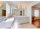 Bathroom featuring a double sink vanity and skylight at 1104 W Seagate Dr, Deltona, FL 32725