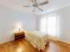 This bedroom features hard wood floors and a ceiling fan at 1104 W Seagate Dr, Deltona, FL 32725