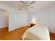This bedroom features hard wood floors and a ceiling fan at 1104 W Seagate Dr, Deltona, FL 32725