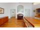 Open dining room area with hardwood floors, decorative accents, and abundant natural light at 1104 W Seagate Dr, Deltona, FL 32725