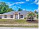 Charming single-story home with neutral paint, simple landscaping and a well-maintained front yard at 1104 W Seagate Dr, Deltona, FL 32725