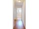 Hallway leading to the bathroom with wood flooring at 1104 W Seagate Dr, Deltona, FL 32725