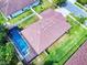 Aerial view of home with pool, fenced yard, and well-maintained roof at 112 Tuscany Bend St, Daytona Beach, FL 32117