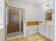 Well-lit bathroom features double sinks, bathtub, and glass-enclosed shower at 112 Tuscany Bend St, Daytona Beach, FL 32117