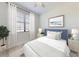 Cozy bedroom featuring a large window, plush bed, and stylish decor at 112 Tuscany Bend St, Daytona Beach, FL 32117