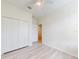 Room with a closet with 3 doors, wood look floors, and a ceiling fan at 112 Tuscany Bend St, Daytona Beach, FL 32117