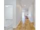 Hallway with tan ceramic tile floors and a view into other rooms at 112 Tuscany Bend St, Daytona Beach, FL 32117