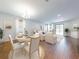 Bright and airy living area with wood floors, neutral furniture, and ample natural light at 112 Tuscany Bend St, Daytona Beach, FL 32117