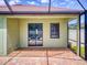 Covered patio with brick flooring offers a relaxing outdoor space with easy access to the pool at 112 Tuscany Bend St, Daytona Beach, FL 32117