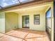 Covered patio with brick flooring, perfect for outdoor dining and relaxation overlooking the pool at 112 Tuscany Bend St, Daytona Beach, FL 32117
