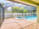 Screened-in pool area featuring a pool and a jacuzzi; ideal for outdoor entertainment and relaxation at 112 Tuscany Bend St, Daytona Beach, FL 32117