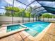 Screened-in pool with an attached jacuzzi, ideal for relaxing and entertaining in a private outdoor setting at 112 Tuscany Bend St, Daytona Beach, FL 32117
