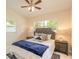 Comfortable bedroom featuring neutral decor, soft lighting, and a plush bed with stylish pillows at 118 N Sunland Dr, Sanford, FL 32773
