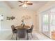 Cozy dining area with modern decor and access to the sun room at 118 N Sunland Dr, Sanford, FL 32773