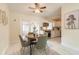 Cozy dining area with seating for four adjacent to the kitchen at 118 N Sunland Dr, Sanford, FL 32773