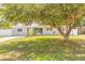 Charming single-story home featuring a well-maintained lawn and mature trees in a serene neighborhood at 118 N Sunland Dr, Sanford, FL 32773