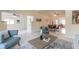 Spacious living room with modern furniture and decor open to adjacent dining area at 118 N Sunland Dr, Sanford, FL 32773