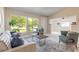 Bright living room with modern furniture and large window at 118 N Sunland Dr, Sanford, FL 32773