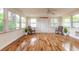 Inviting sunroom with natural light and hardwood flooring, perfect for relaxing at 118 N Sunland Dr, Sanford, FL 32773