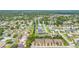 High aerial showing neighborhood, houses and community canal with beautiful waterfront views at 118 Tuscany Villas Dr, Edgewater, FL 32141