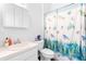 Bathroom featuring single vanity and shower/tub combo with sea life patterned shower curtain at 118 Tuscany Villas Dr, Edgewater, FL 32141