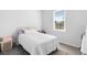 Bright bedroom with a window, white walls, and neutral carpet at 118 Tuscany Villas Dr, Edgewater, FL 32141