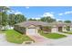 Charming villa featuring a two-car garage and a beautifully paved driveway at 118 Tuscany Villas Dr, Edgewater, FL 32141