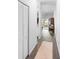Open hallway featuring wood-look flooring, and access to the living spaces at 118 Tuscany Villas Dr, Edgewater, FL 32141