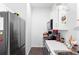 Efficient white kitchen featuring stainless steel appliances and neutral decor at 118 Tuscany Villas Dr, Edgewater, FL 32141
